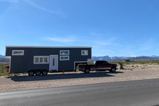 mobile home on the back of a car