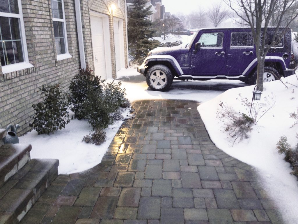 clear walkway leading to a driveway because of radiant floor heating