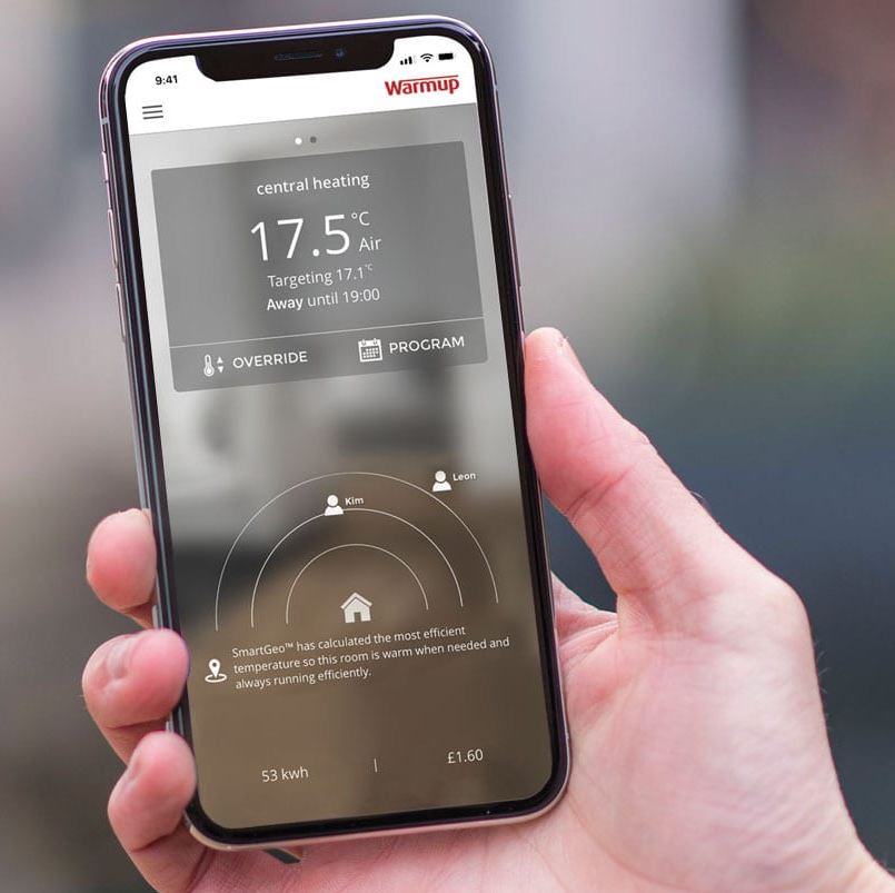 A smartphone showing Warmup's MyHeating App for electric radiant underfloor heating remote control.