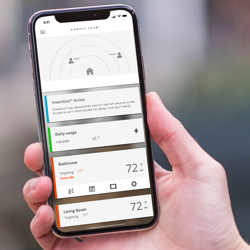 A hand holding an iPhone displaying Warmup's MyHeating App.