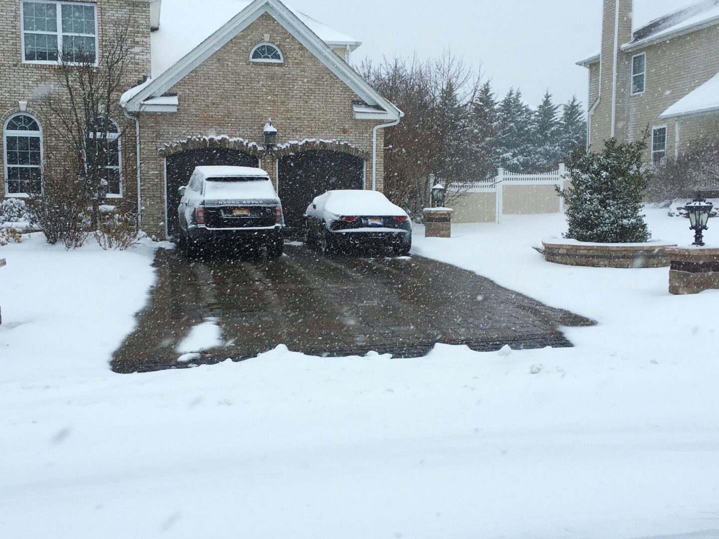 Alt Text: a heated driveway operating in the middle of snow
