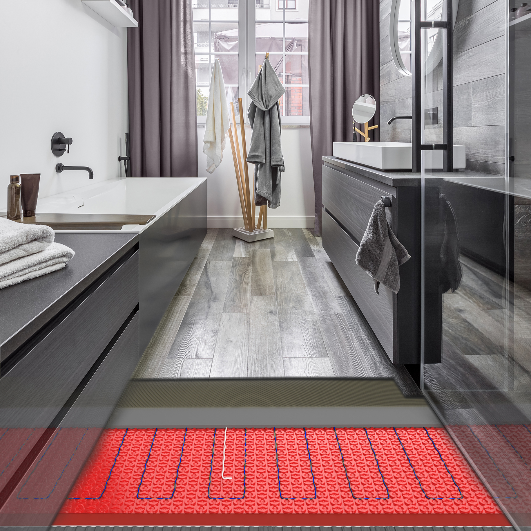 Warmup underfloor heating cables installed under a vinyl plank floor in a bathroom