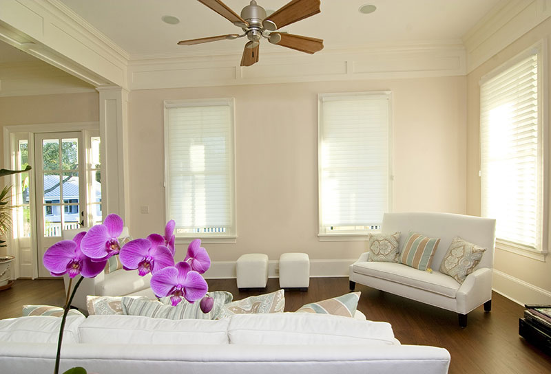 spacious living room with purple flower