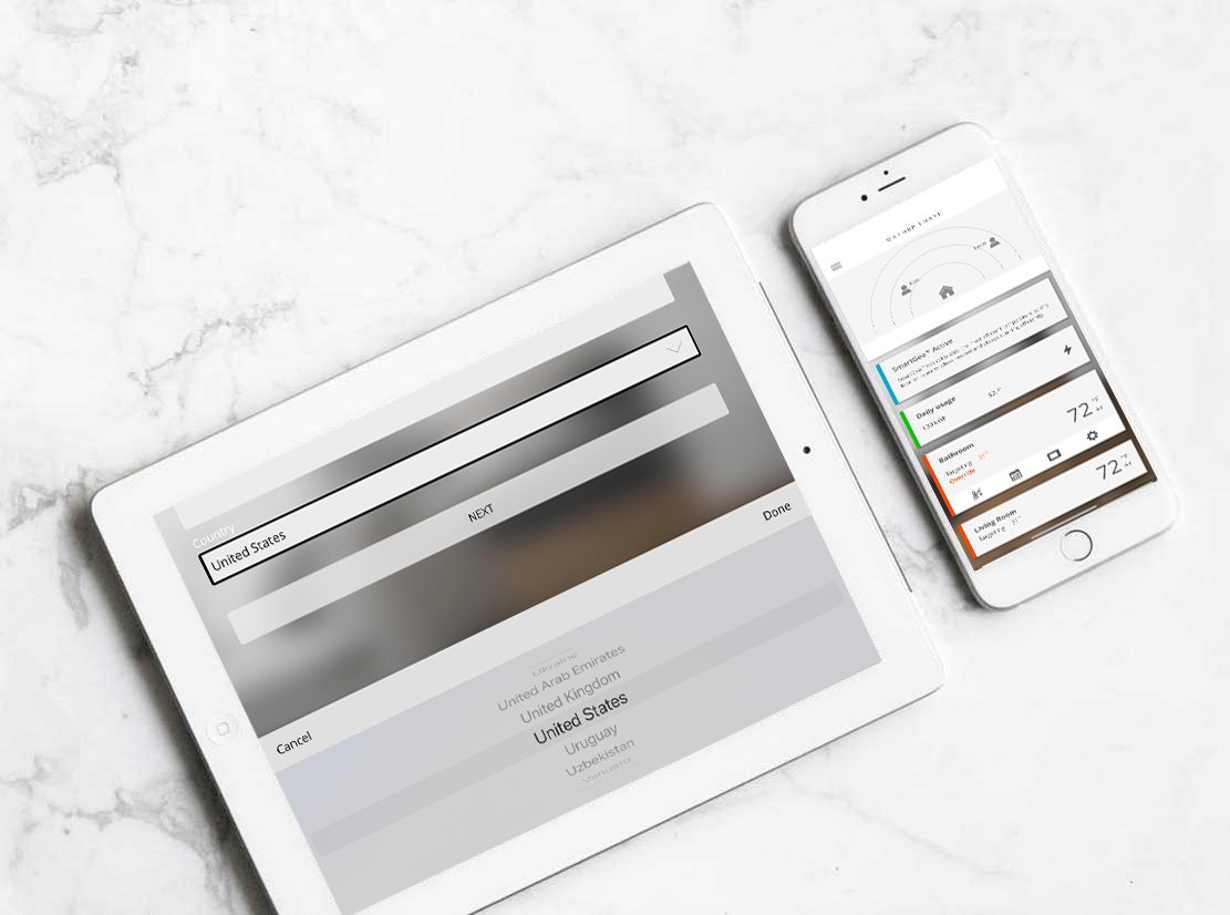 An iPhone and an iPad on a table displaying Warmup's MyHeating app.