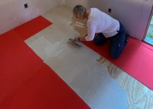 Installing the Ultralight Insulation Boards with an adhesive.